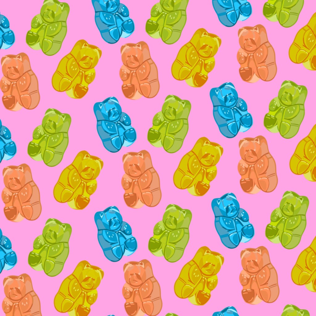 Colorful gummy bear pattern over a light pink background.